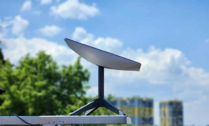 a white Starlink sitting on top of a metal pole