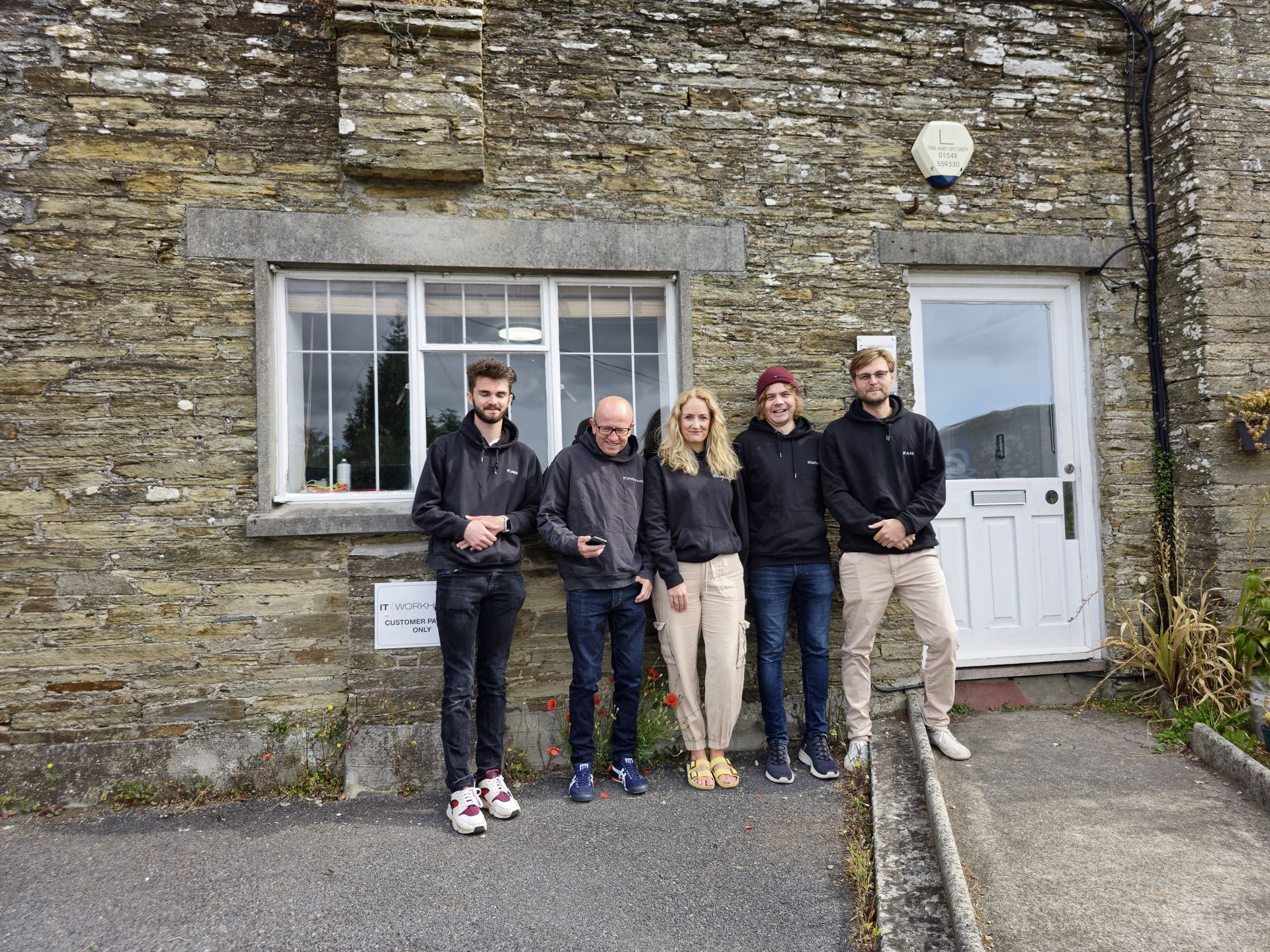 The IT WORKHOUSE team outside The Old Workhouse, Kingsbridge